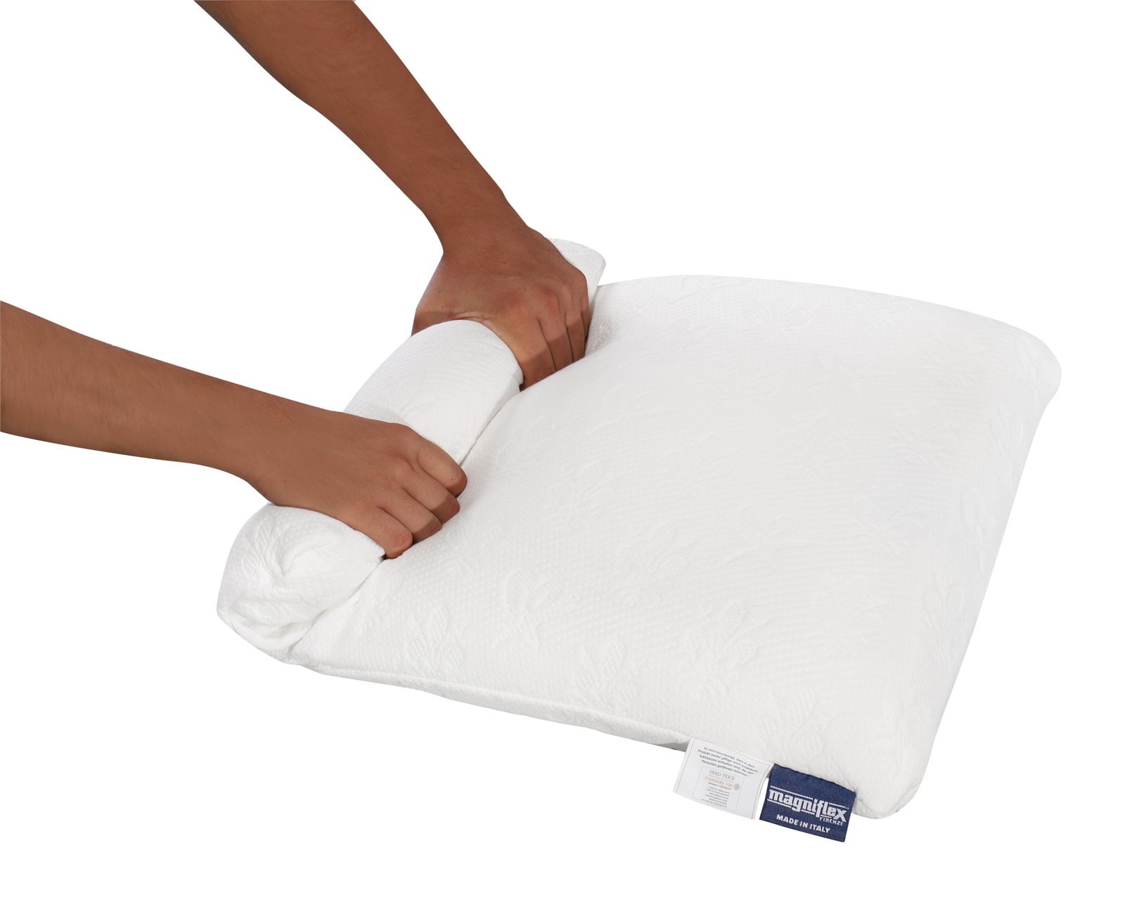 Magniflex Classico Smart Pillow being rolled for packing